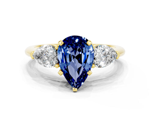 Yellow gold Three-Stone Pear Cut Blue Sapphire Ring with Pear Side Stones and Four-Prong Setting