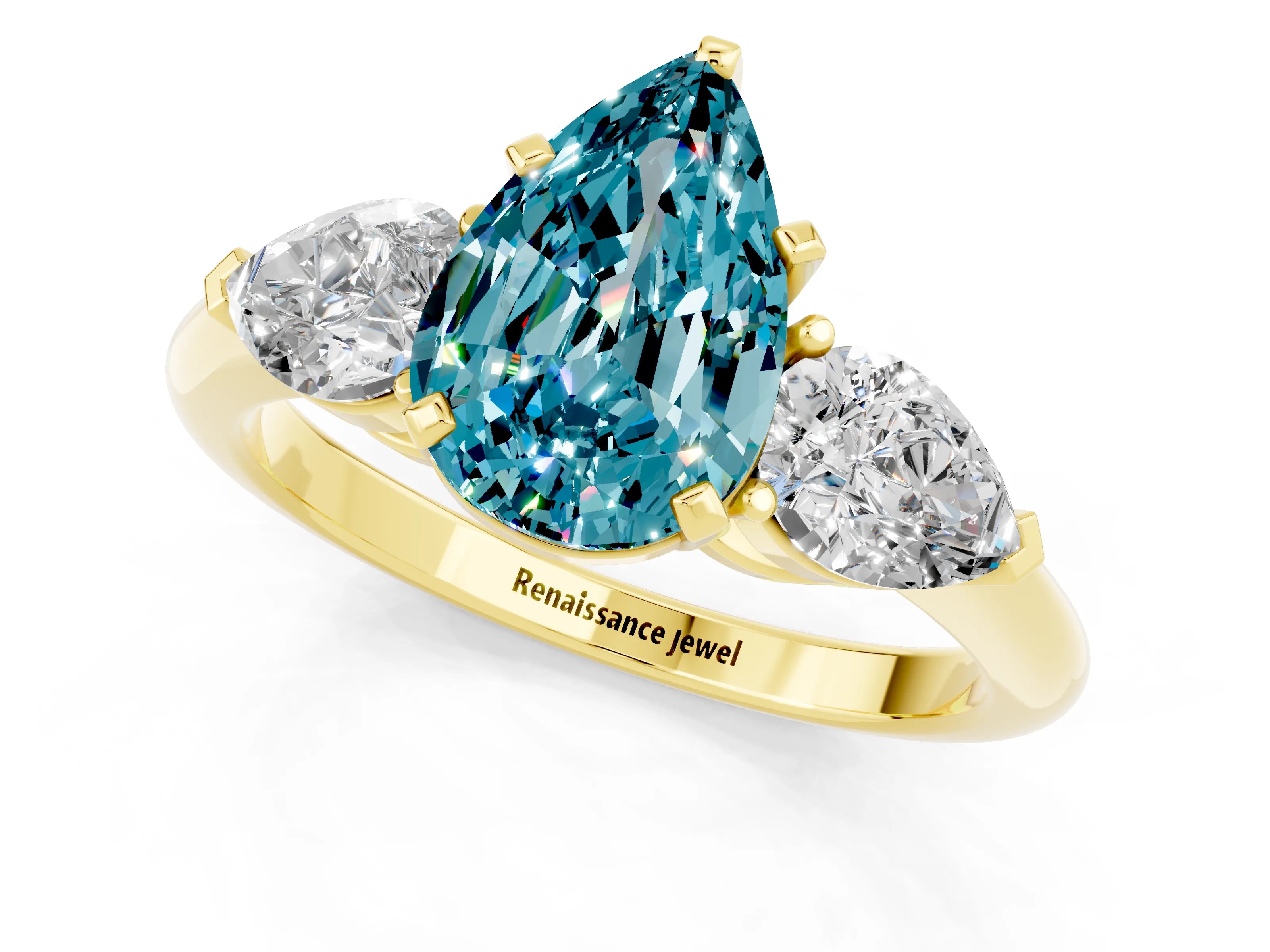 Yellow gold Three-Stone Pear Cut Blue Topaz Ring with Pear Side Stones and Four-Prong Setting_1