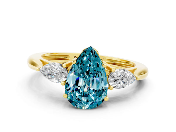 Yellow gold Three-Stone Pear Cut Blue Topaz Ring with Pear  Side Stones in Four-Prong Setting