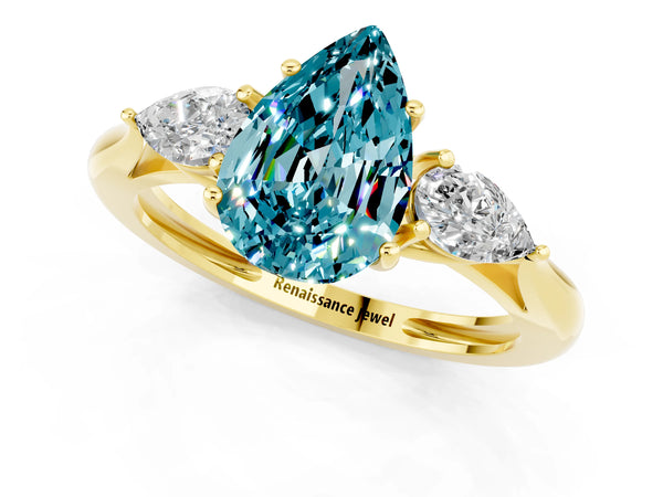 Yellow gold Three-Stone Pear Cut Blue Topaz Ring with Pear  Side Stones in Four-Prong Setting