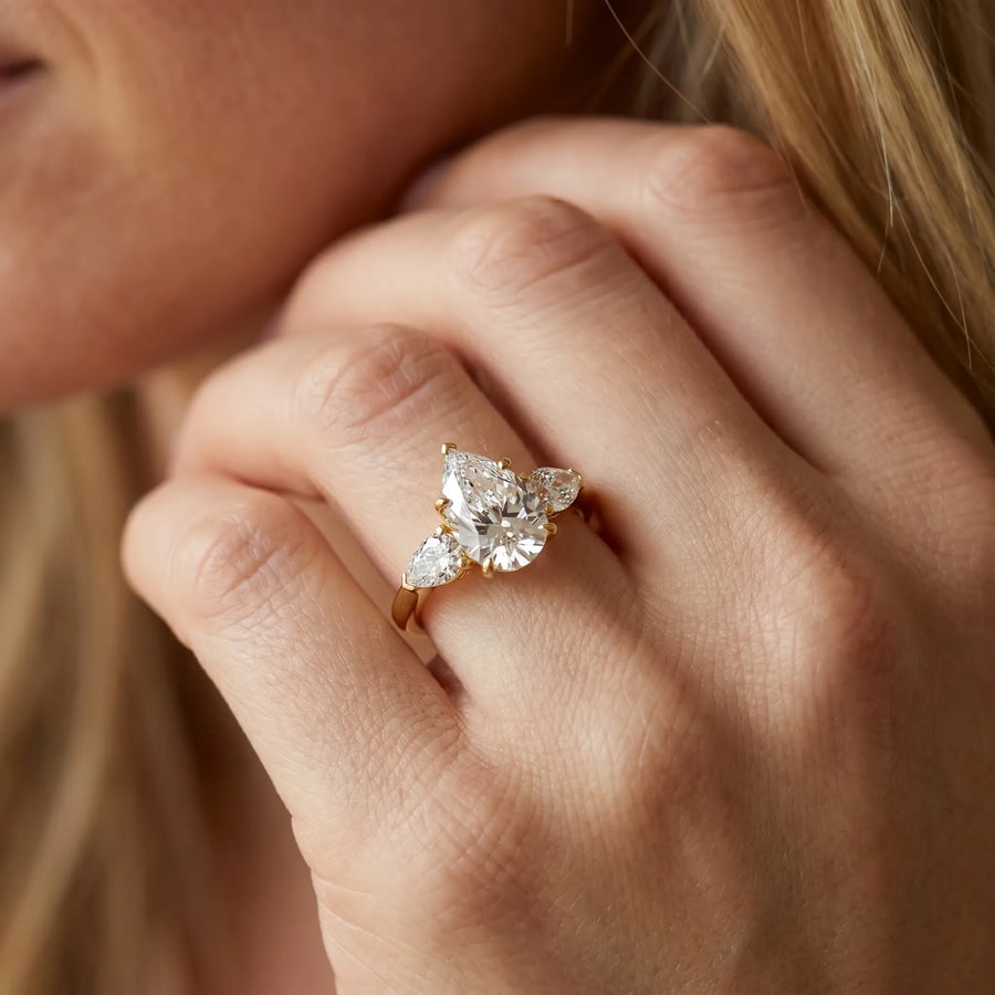 Yellow gold Three-Stone Pear Cut Diamond Ring with Pear Side Stones and Four-Prong Setting