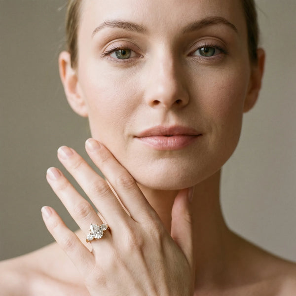 Yellow gold Three-Stone Pear Cut Diamond Ring with Round Accent Stones, Prong Setting, and Classic Band