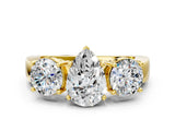 Yellow gold Three-Stone Pear Cut Diamond Ring with Round Side Stones, Classic Band, and Four-Prong Setting_7