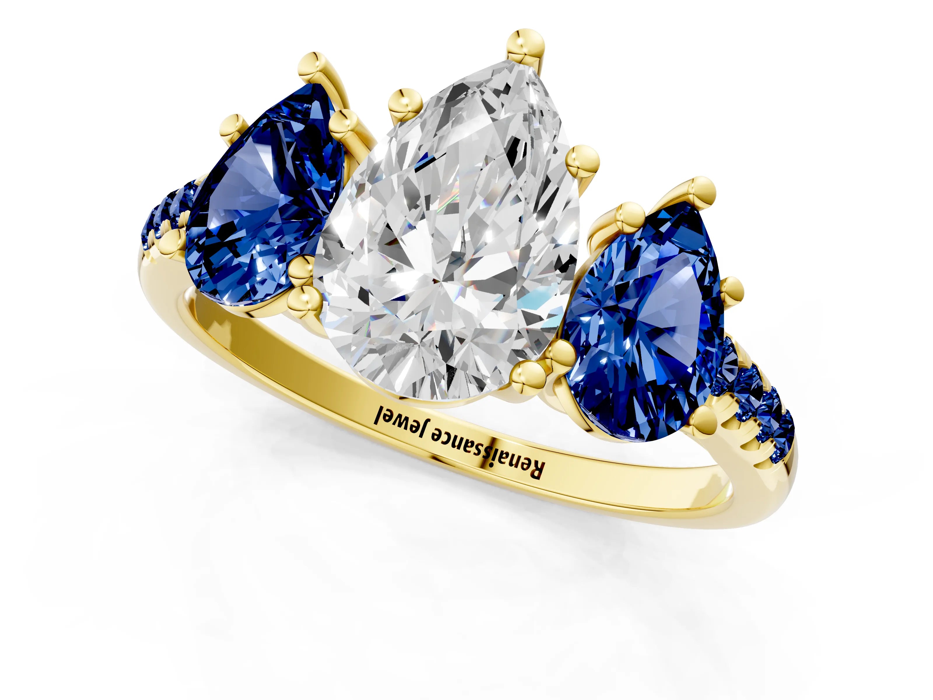 Yellow gold Three-Stone Pear Cut Diamond Ring with Round with Blue Sapphire side stone Pavé Band and Prong Setting_1