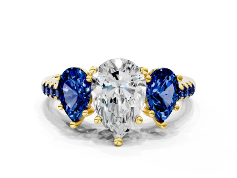 Yellow gold Three-Stone Pear Cut Diamond Ring with Round with Blue Sapphire side stone Pavé Band and Prong Setting