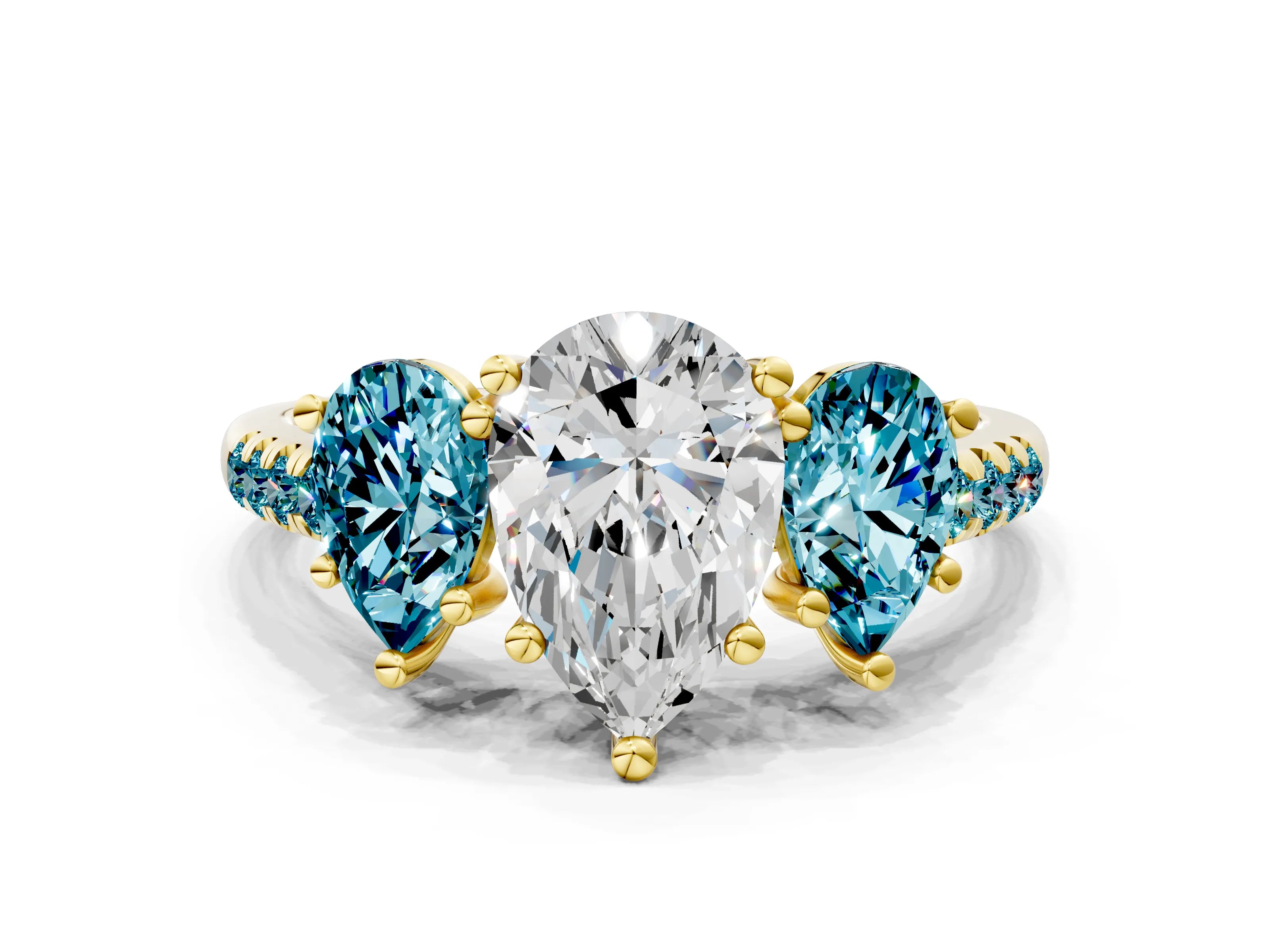 Yellow gold Three-Stone Pear Cut Diamond Ring with Round with Blue Topaz side stone Pavé Band and Prong Setting