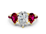Yellow gold Three-Stone Pear Cut Diamond Ring with Round with Garnet side stone Pavé Band and Prong Setting
