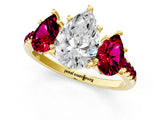 Yellow gold Three-Stone Pear Cut Diamond Ring with Round with Garnet side stone Pavé Band and Prong Setting_1