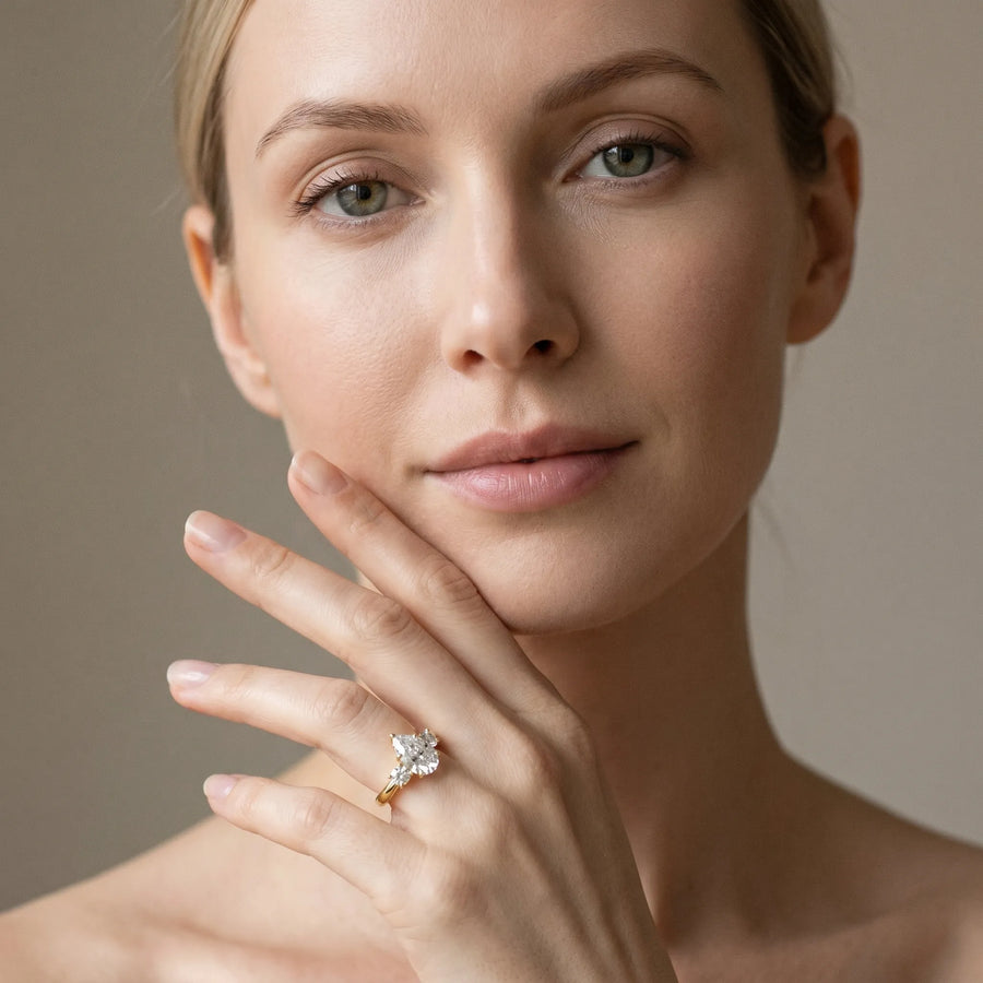 Yellow gold Three-Stone Pear Cut Diamond Solitaire with Prong Setting and Classic Band