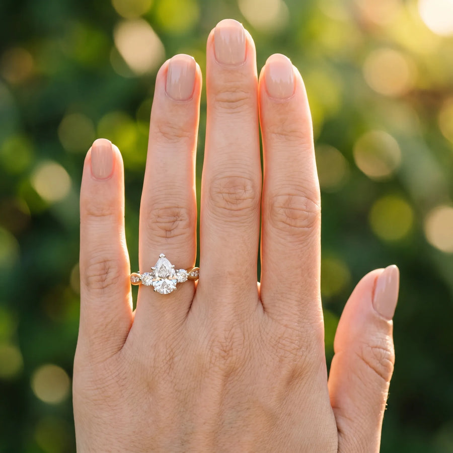 Yellow gold Three-Stone Pear Diamond Channel Set Engagement Ring with Prong Setting