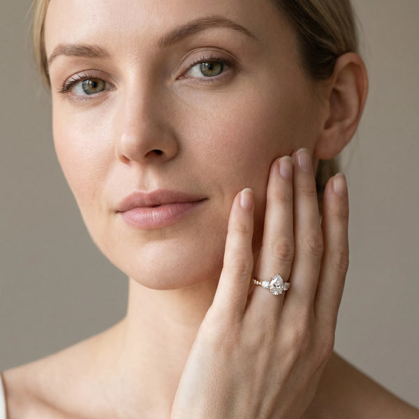 Yellow gold Three-Stone Pear Diamond Channel Set Engagement Ring with Prong Setting