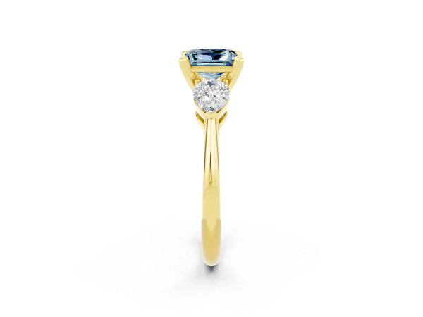 Yellow gold Three-Stone Princess Cut Aquamarine Ring with Pear Side Stones and Four-Prong Setting