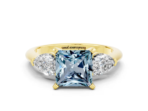 Yellow gold Three-Stone Princess Cut Aquamarine Ring with Pear Side Stones and Four-Prong Setting