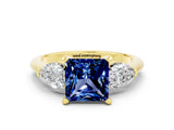 Yellow gold Three-Stone Princess Cut Blue Sapphire Ring with Pear Side Stones and Four-Prong Setting