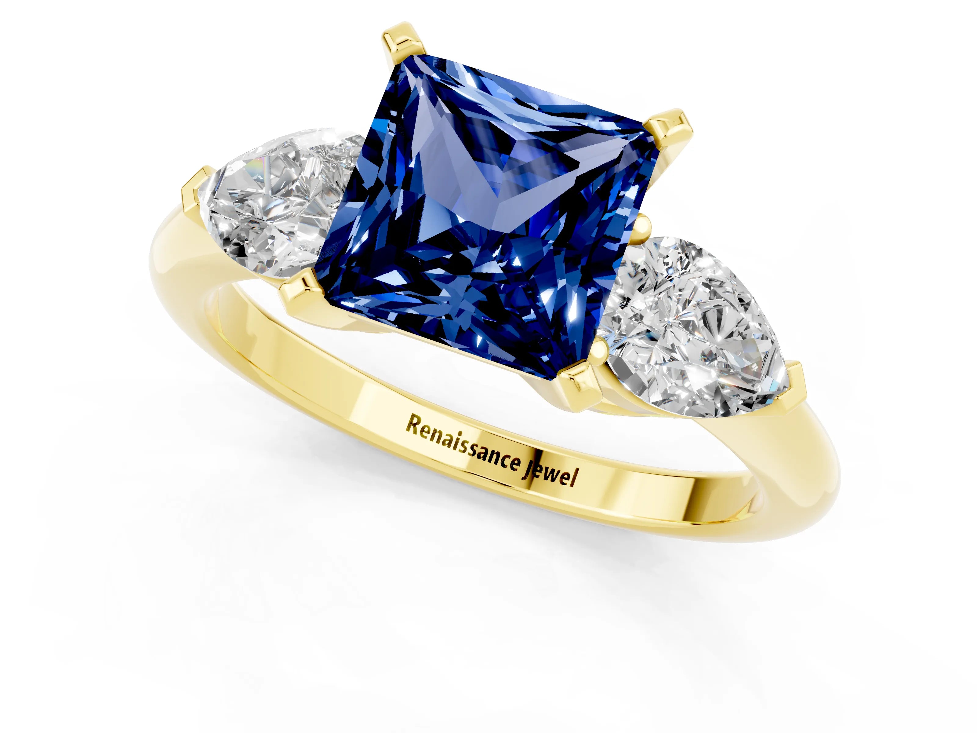 Yellow gold Three-Stone Princess Cut Blue Sapphire Ring with Pear Side Stones and Four-Prong Setting_1