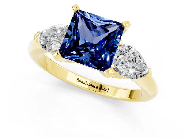Yellow gold Three-Stone Princess Cut Blue Sapphire Ring with Pear Side Stones and Four-Prong Setting