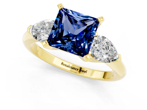 Yellow gold Three-Stone Princess Cut Blue Sapphire Ring with Pear Side Stones and Four-Prong Setting_1