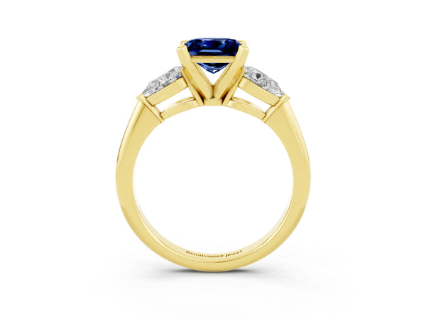 Yellow gold Three-Stone Princess Cut Blue Sapphire Ring with Pear Side Stones and Four-Prong Setting