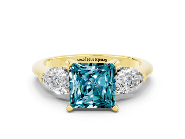Yellow gold Three-Stone Princess Cut Blue Topaz Ring with Pear Side Stones and Four-Prong Setting