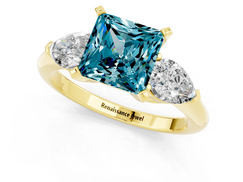 Yellow gold Three-Stone Princess Cut Blue Topaz Ring with Pear Side Stones and Four-Prong Setting_1
