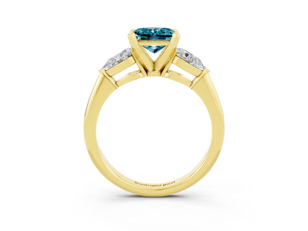 Yellow gold Three-Stone Princess Cut Blue Topaz Ring with Pear Side Stones and Four-Prong Setting