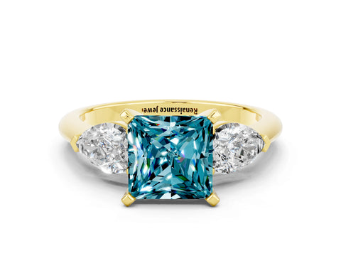 Yellow gold Three-Stone Princess Cut Blue Topaz Ring with Pear Side Stones and Four-Prong Setting