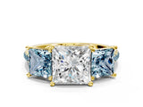 Yellow gold Three-Stone Princess Cut Diamond Ring with Round with Aquamarine side stone Pavé Band and Prong Setting