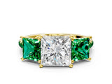 Yellow gold Three-Stone Princess Cut Diamond Ring with Round with Emerald side stone Pavé Band and Prong Setting