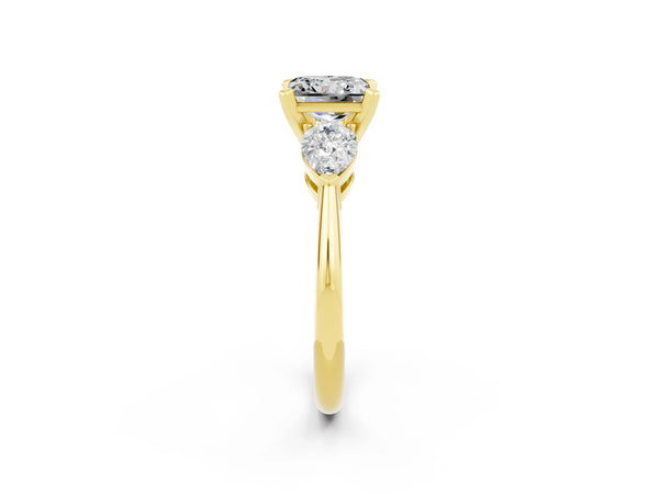 Yellow gold Three-Stone Princess Cut Moissanite Ring with Pear Side Stones and Four-Prong Setting