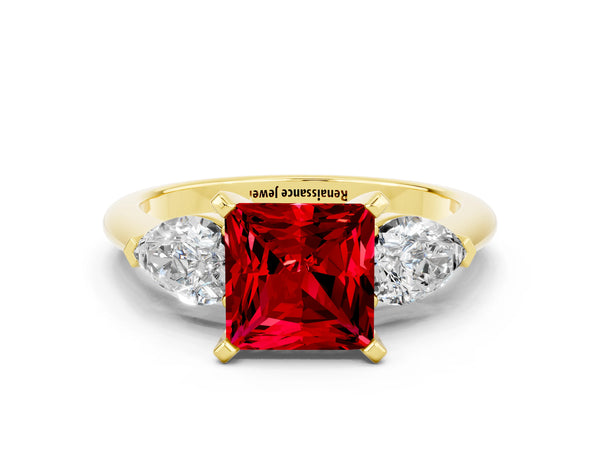 Yellow gold Three-Stone Princess Cut Ruby Ring with Pear Side Stones and Four-Prong Setting