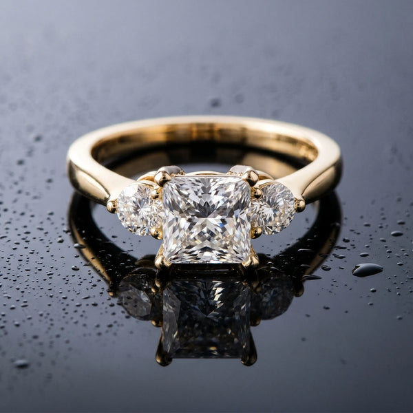 Yellow gold Three-Stone Princess Solitaire Ring with Tapered Band and Four-Prong Setting