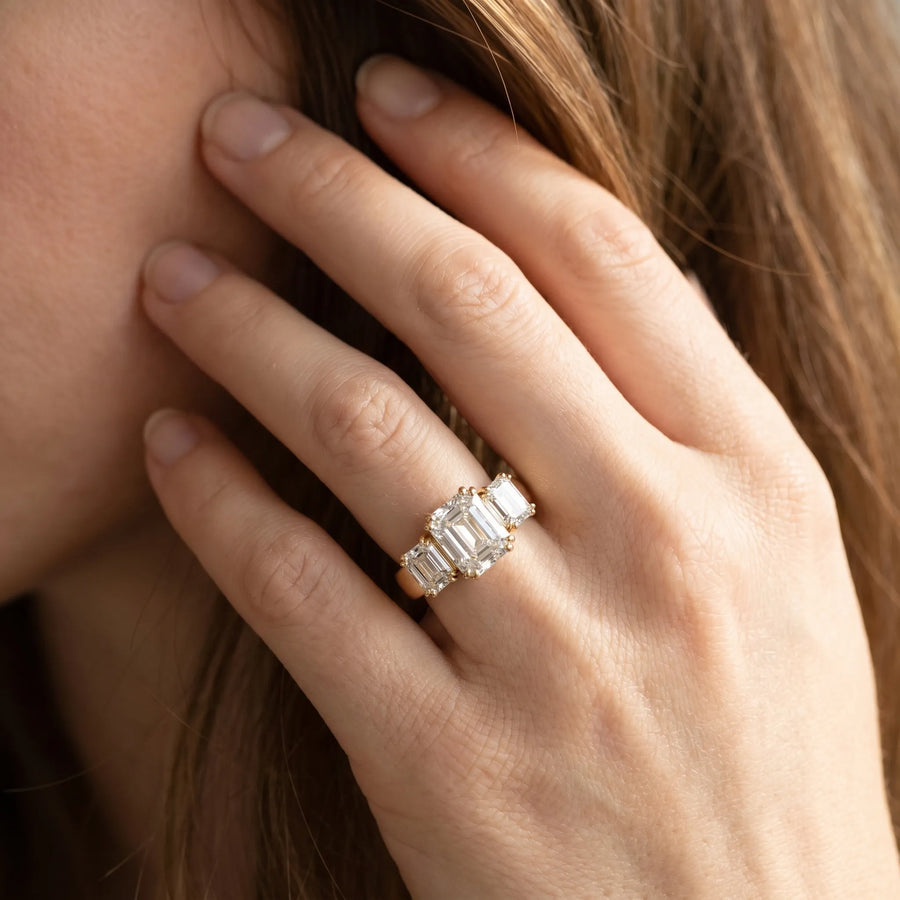 Yellow gold Three-Stone Radiant Cut Diamond Ring with Channel Set Band and Four-Prong Setting