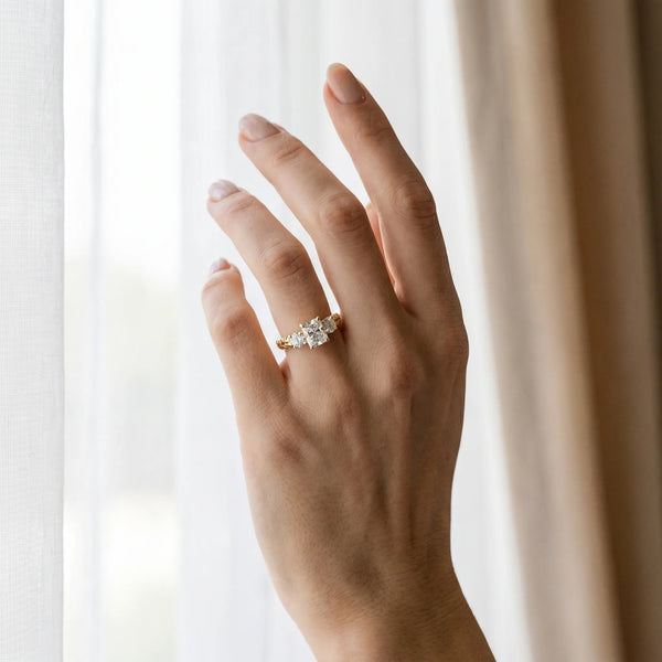 Yellow gold Three-Stone Radiant Cut Diamond Ring with Channel-Set Band and Prong Setting
