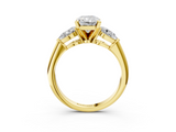 18K Yellow Gold Three-Stone 4.05 Carat E VVS2 Radiant Diamond Ring with Pear Side Stones and Four-Prong Setting