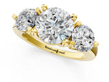 Yellow gold Three-Stone Round Brilliant Cut Solitaire Ring with Prong Setting on a Classic Band 1