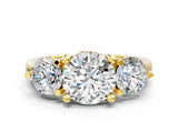 Yellow gold Three-Stone Round Brilliant Cut Solitaire Ring with Prong Setting on a Classic Band