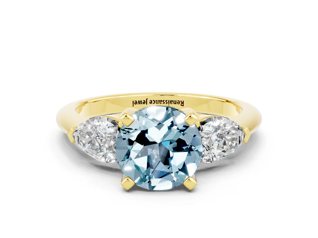 Yellow gold Three-Stone Round Cut Aquamarine Ring with Pear Side Stones and Four-Prong Setting
