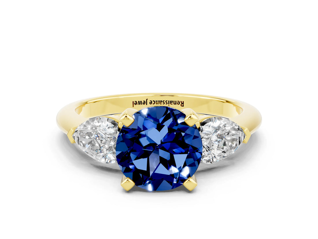 Yellow gold Three-Stone Round Cut Blue Sapphire Ring with Pear Side Stones and Four-Prong Setting