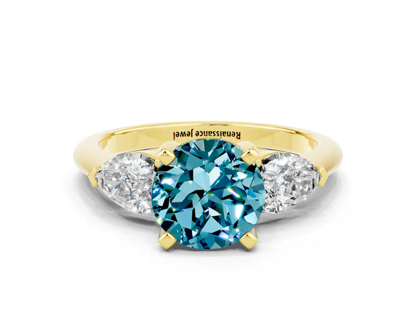 Yellow gold Three-Stone Round Cut Blue Topaz Ring with Pear Side Stones and Four-Prong Setting