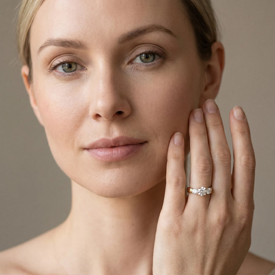 Yellow gold Three-Stone Round Cut Channel Set Diamond Ring with Four-Prong Setting