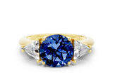 Yellow gold Three-Stone Round Cut Cut Diamond Ring with Trillion Side Stones and Four-Prong Setting