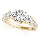 Yellow gold Three-Stone Round Cut Diamond Engagement Ring with Split Shank and Prong Setting