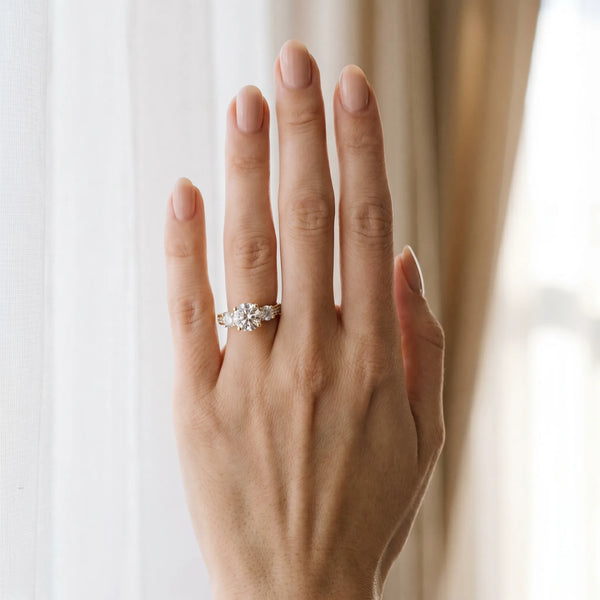 Yellow gold Three-Stone Round Cut Diamond Engagement Ring with Split Shank and Prong Setting