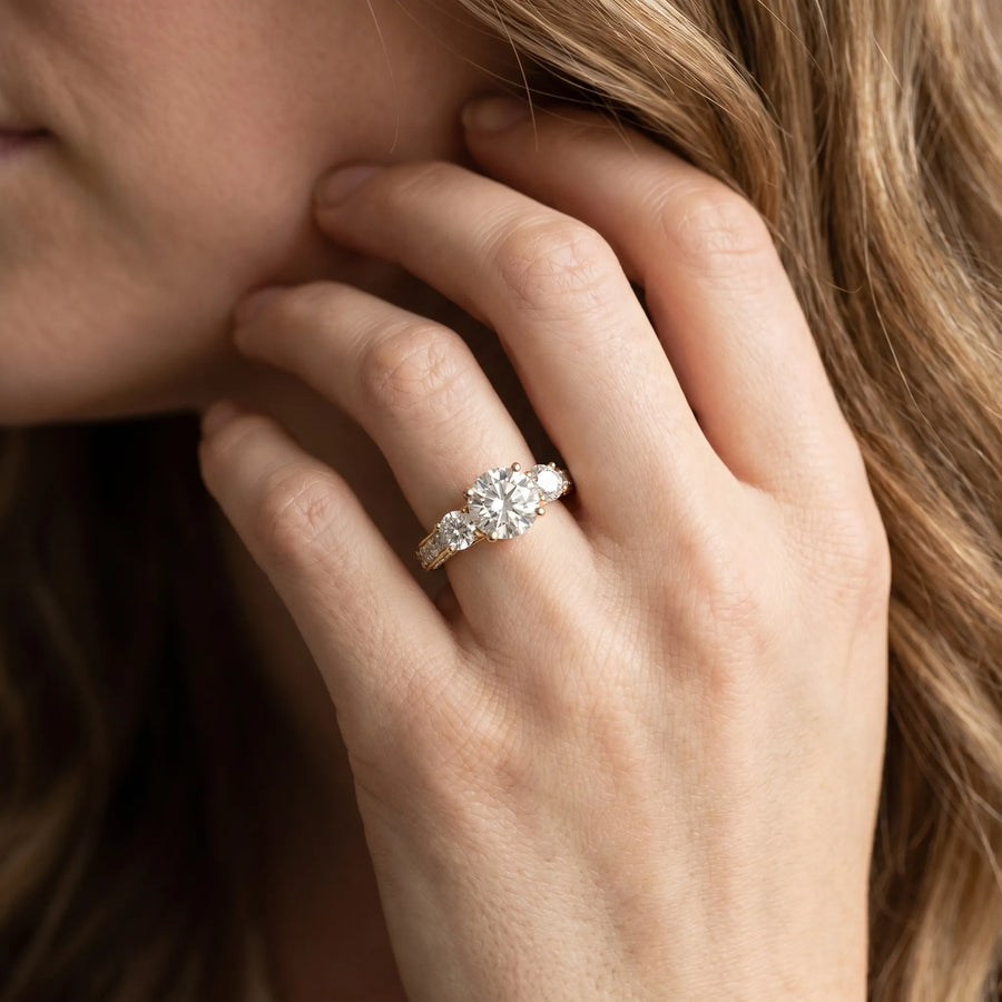 Yellow gold Three-Stone Round Cut Diamond Engagement Ring with Split Shank and Prong Setting