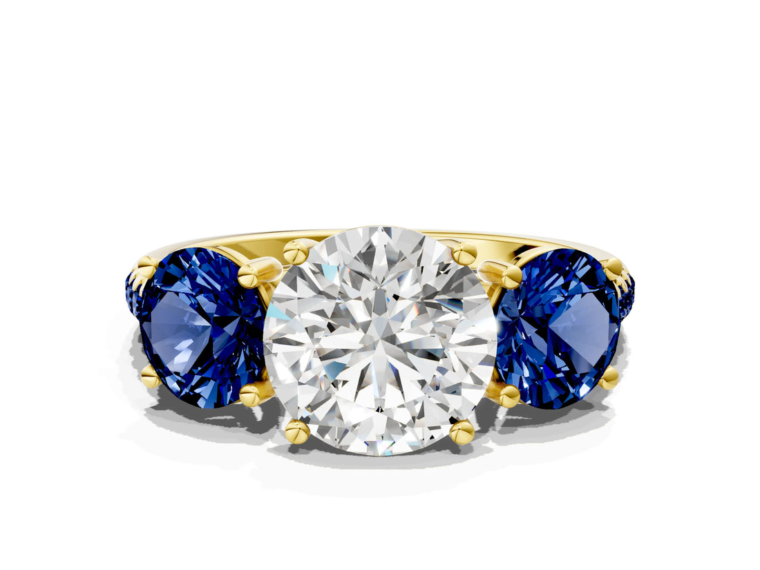 Yellow gold Three-Stone Round Cut Diamond Ring with Round with Blue Sapphire side stone Pavé Band and Prong Setting