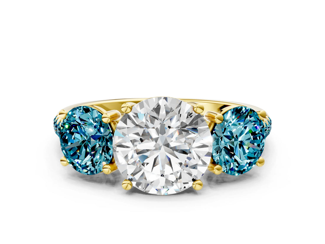 Yellow gold Three-Stone Round Cut Diamond Ring with Round with Blue Topaz side stone Pavé Band and Prong Setting