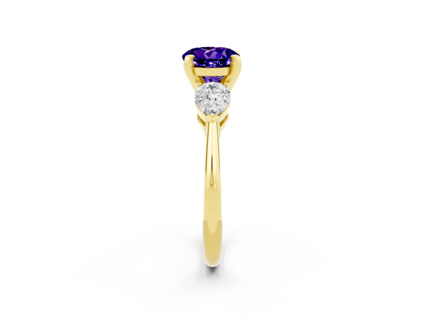 Yellow gold Three-Stone Round Cut Tanzanite Ring with Pear Side Stones and Four-Prong Setting