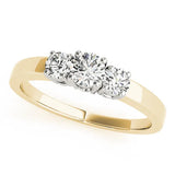 Yellow gold Three-Stone Round Diamond Solitaire Ring with Channel Set Band and Four-Prong Setting