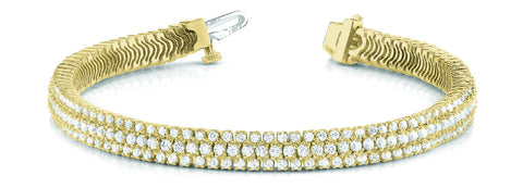 Yellow gold Triple Row Round Diamond Tennis Bracelet with Channel Set Stones and Four-Prong Setting