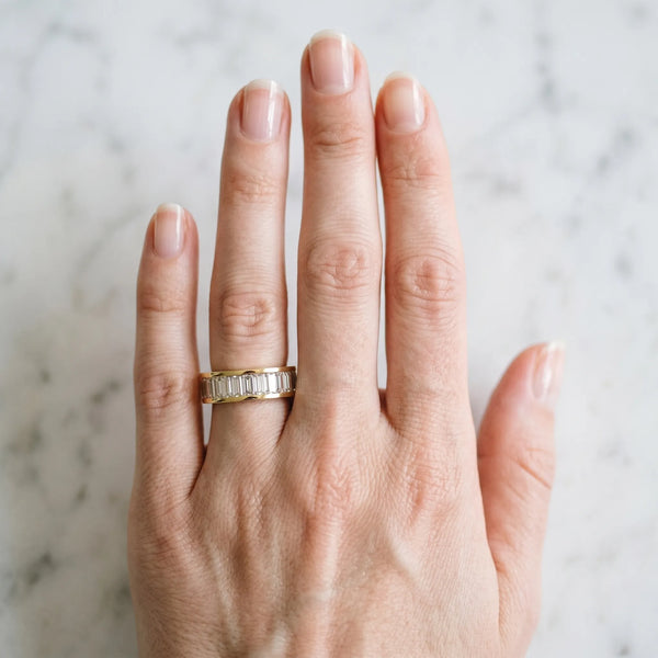 Yellow gold baguette cut diamond eternity band with channel set